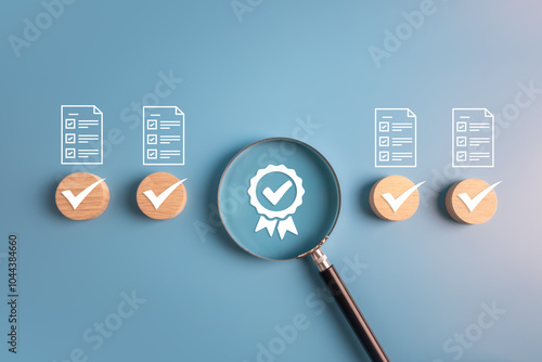 Quality assurance checklist, ISO standard, best quality score and product warranty concept.wooden block and magnifier with business icons.