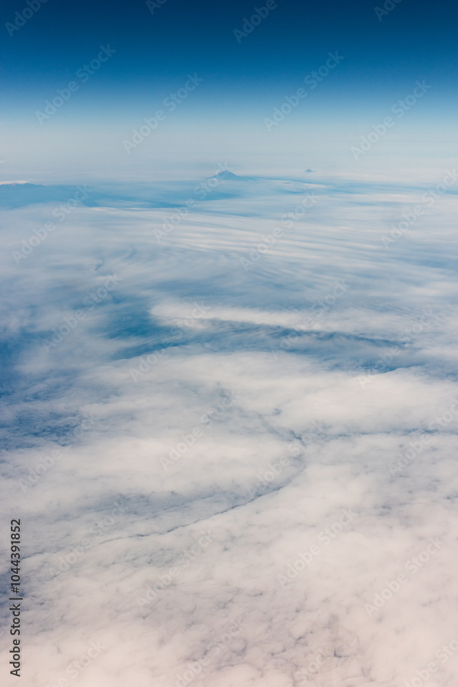 View from an airplane of the Kuril Islands and Sea of Okhotsk on a flight from Vancouver to Tokyo View from an airplane of the Kuril Islands and Sea of Okhotsk on a flight from Vancouver to Tokyo