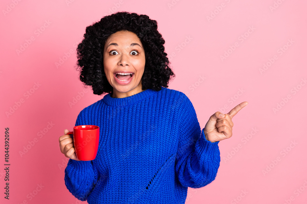 Photo of young amazed woman with wavy hair morning espresso coffee directing finger cafeteria summer menu isolated on pink color background