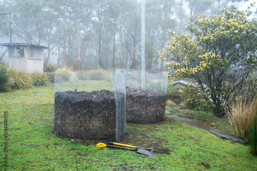 making Compost ring, organic thermophilic compost turning in Tasmania Australia. photo