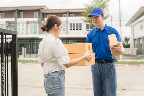 Delivery Service: Happy Customer Receiving Package from Courier. Smiling delivery man handing package to happy customer at her doorstep. 