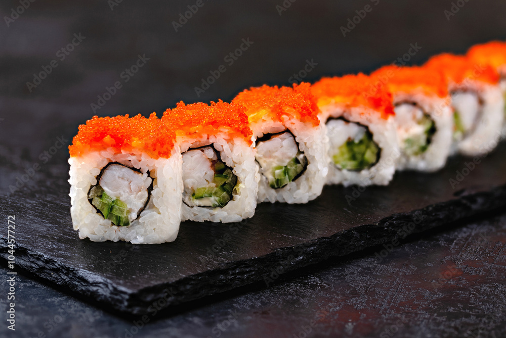 Japanese sushi, rolls with shrimp and caviar on a black background Japanese sushi, rolls with shrimp and caviar on a black background