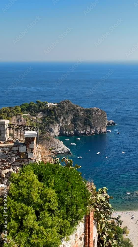 The sea and the beach of Isola Bella in Taormina, Sicily, Southern Italy.
Aerial shot of the bay of Taormina with Isola Bella connected to the mainland by an isthmus of land. The sea and the beach of Isola Bella in Taormina, Sicily, Southern Italy.
Aerial shot of the bay of Taormina with Isola Bella connected to the mainland by an isthmus of land.