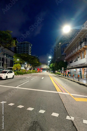 Asphalt Road and City Street With Modern Building at Night