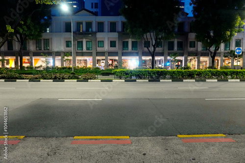 Asphalt Road and City Street With Modern Building at Night
