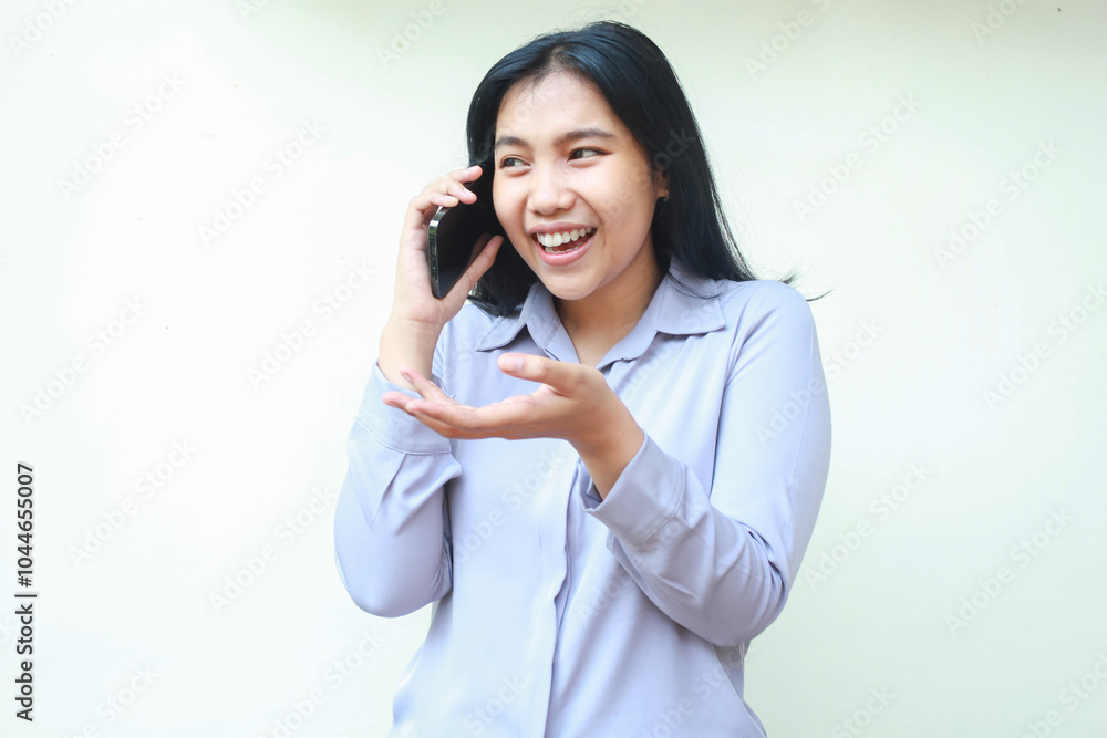 carefree asian young asian business woman excited to make a call to speaking on cell phone with presenting and questioning gesture, wear formal suit isolated in white background carefree asian young asian business woman excited to make a call to speaking on cell phone with presenting and questioning gesture, wear formal suit isolated in white background