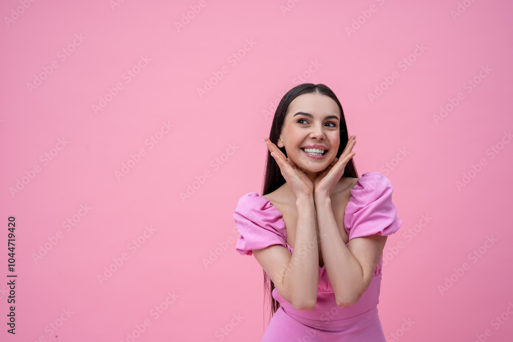 Pretty young long-haired woman in pink dress looking dreamy Pretty young long-haired woman in pink dress looking dreamy