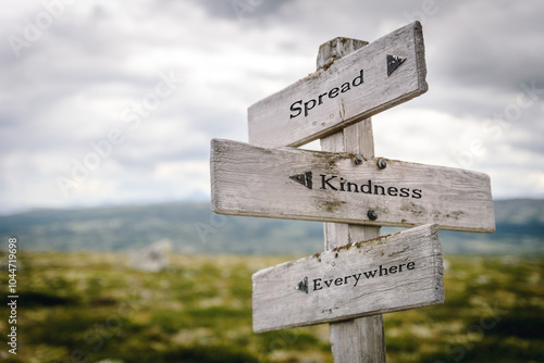 Tableau sur toile spread kindness everywhere text quote written on wooden signpost at the crossroads outdoors in nature