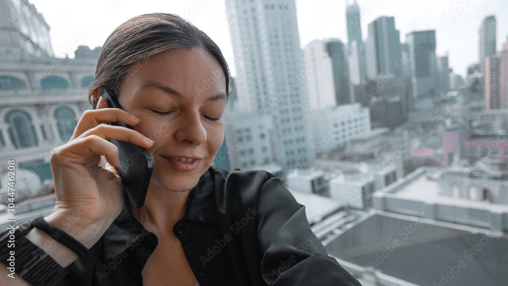 a young woman is talking on the phone