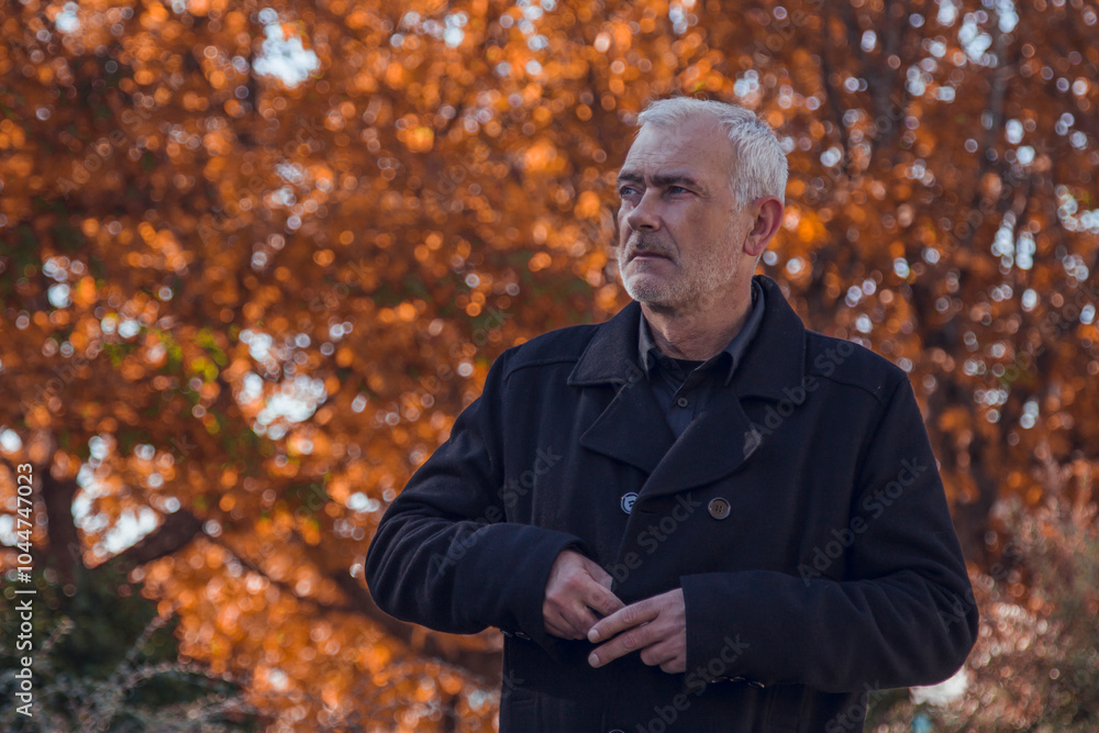 mature man in autumn with coat mature man in autumn with coat