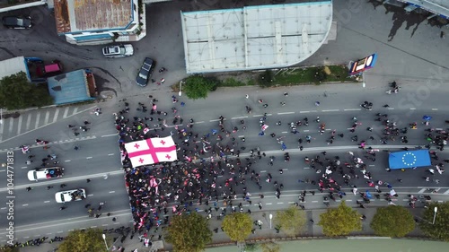 Georgia and eu flag with people protest aerial