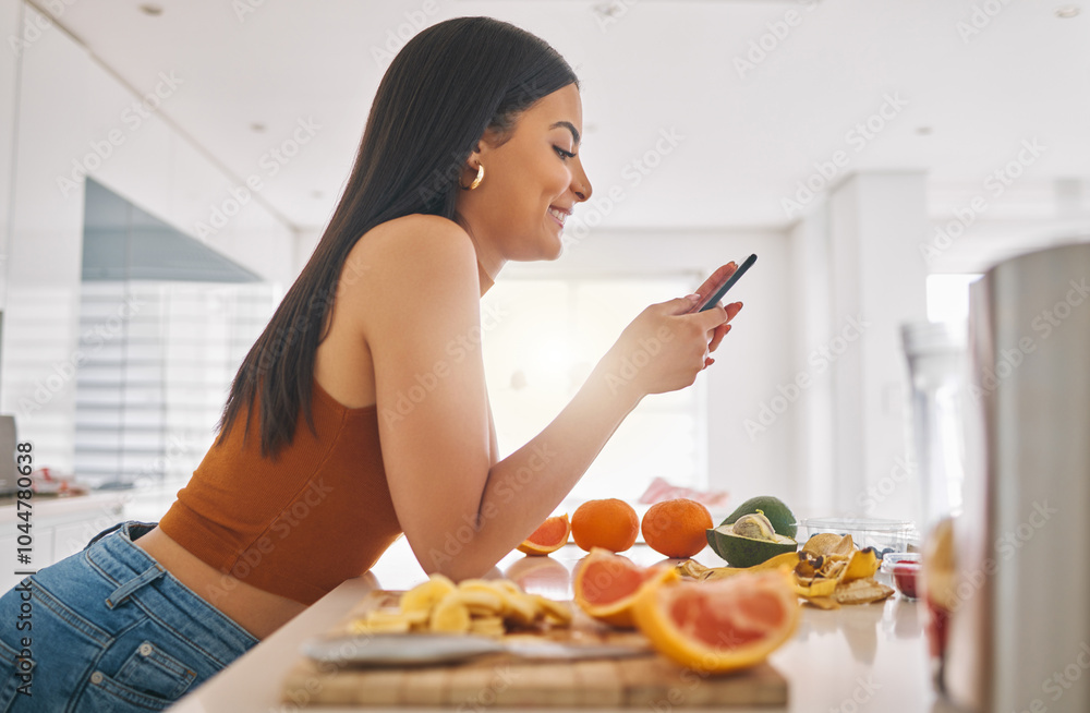 Woman, phone and cooking breakfast in home, typing and fruit for mineral liquid in kitchen. Female person, nutrition and online for social media blog on diet, smoothie cocktail and vegan website Woman, phone and cooking breakfast in home, typing and fruit for mineral liquid in kitchen. Female person, nutrition and online for social media blog on diet, smoothie cocktail and vegan website