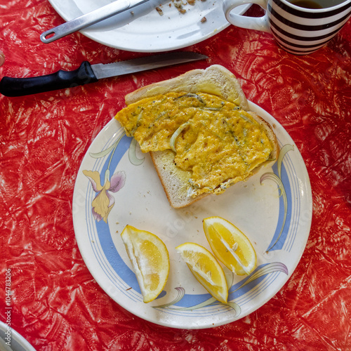 A whitebait pattie or fritter on a slice of buttered white bread, New Zealand