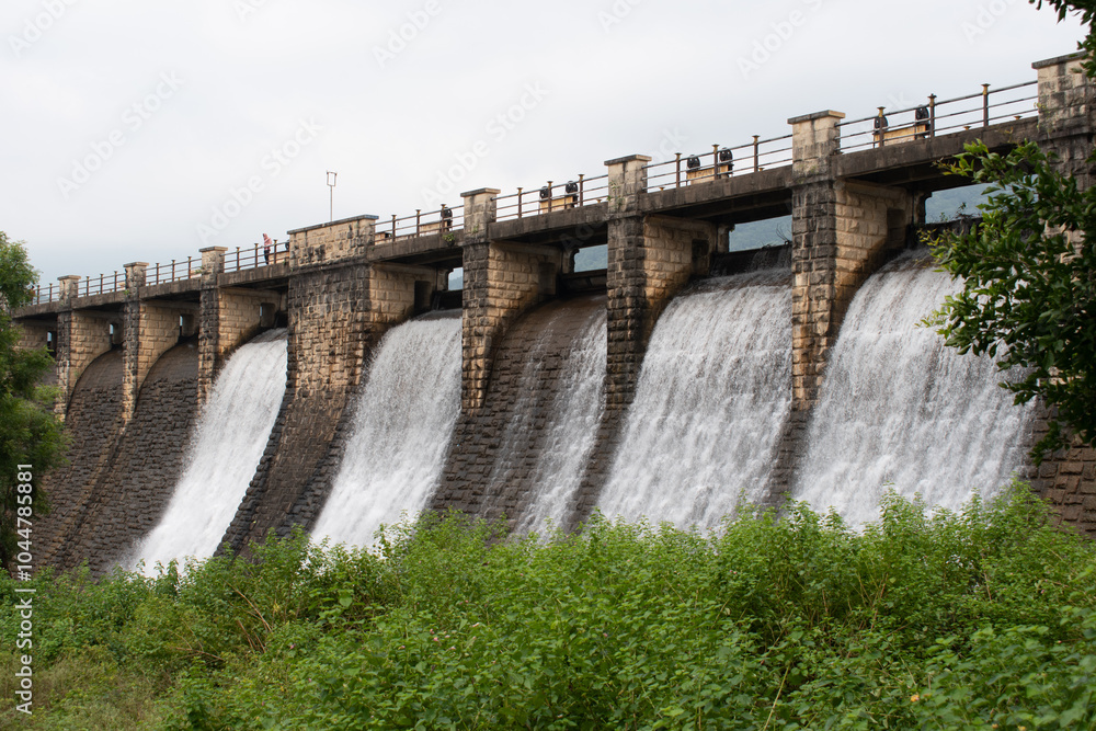 water releases from flood gate of topchachi dam with abundant green surrounding, jharkhand, india water releases from flood gate of topchachi dam with abundant green surrounding, jharkhand, india