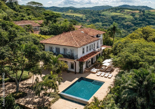 Wallpaper Mural A bird's eye view of the villa, with its white walls and red roof nestled amidst lush greenery on top of steep hills Torontodigital.ca