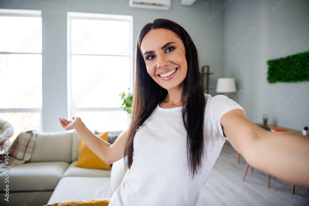 Photo of nice young girl selfie photo point hand house wear white clothes enjoy modern cozy interior flat indoors Photo of nice young girl selfie photo point hand house wear white clothes enjoy modern cozy interior flat indoors
