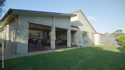 modern house with patio and garden