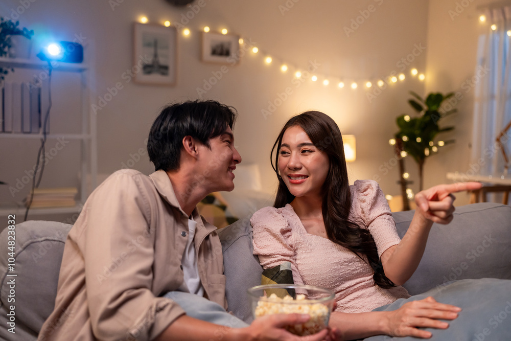 Asian young beautiful woman watching romantic movie on television at home. Asian young beautiful woman watching romantic movie on television at home.
