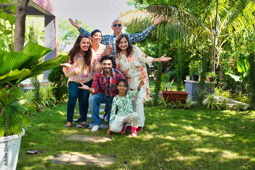 Photography Indian family of six happily posing for a group photo during a camping trip, cap