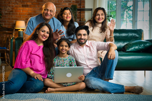 Canvas Print Indian Family of six sitting together on a sofa, sharing joyful moments while us