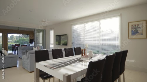 Elegant Living Room with Dining Table and Indoor Patio