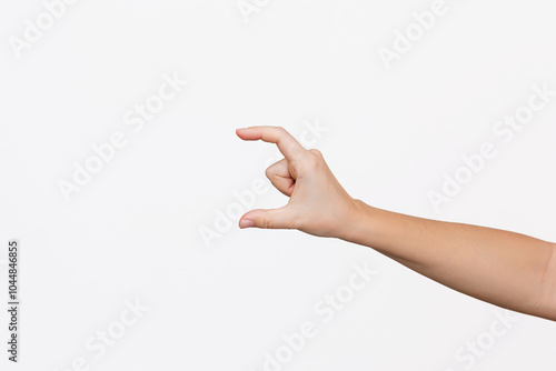 Photography A young woman's hand making a gesture like holding something or measuring isolated on a white background