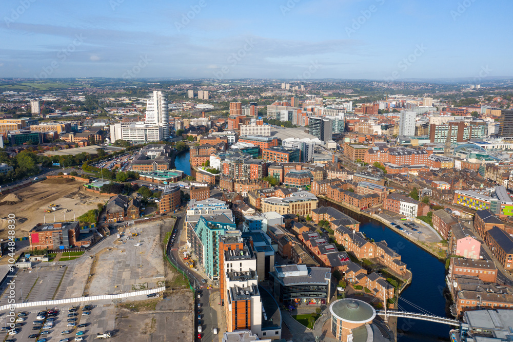 Fototapeta premium Aerial drone photo of the Leeds city centre showing the main city centre from above on a bright sunny summers day in the West Yorkshire city