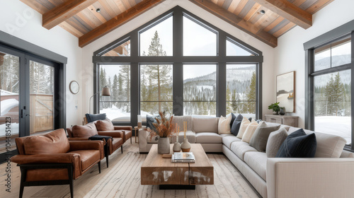 modern minimalist living room featuring large windows that offer stunning views of snowy landscape. space is designed with cozy yet elegant aesthetic, showcasing blend of natural materials and