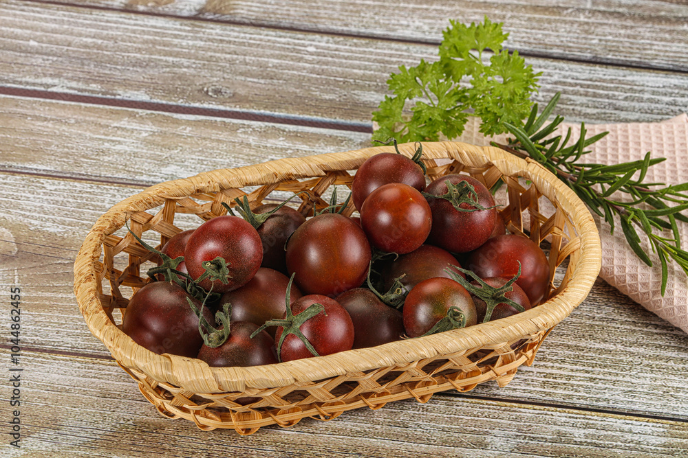 Juicy ripe black cherry tomato Juicy ripe black cherry tomato