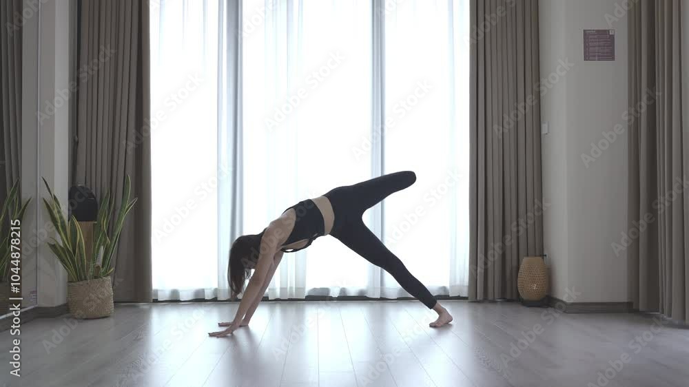 A young woman practicing Yoga_2 A young woman practicing Yoga_2