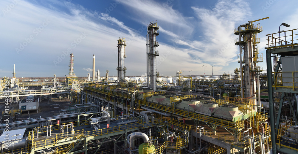 refinery - chemical factory at night with buildings, pipelines and lighting - industrial plant refinery - chemical factory at night with buildings, pipelines and lighting - industrial plant