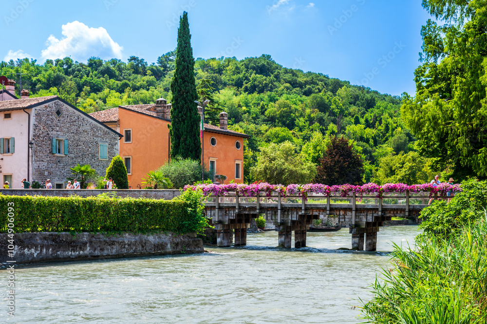 Fototapeta premium Summer on the Mincio river. Historic village of Borghetto sul Mincio