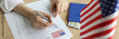 Obraz na płótnie Young woman fills in visa application form near USA flag w salonie