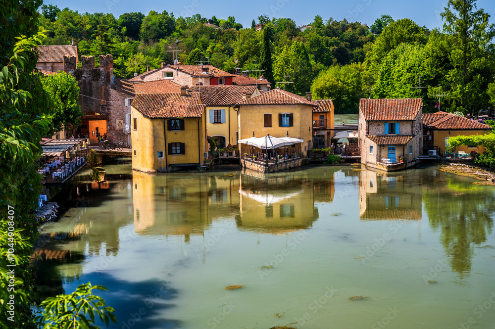 Summer on the Mincio river. Historic village of Borghetto sul Mincio Summer on the Mincio river. Historic village of Borghetto sul Mincio