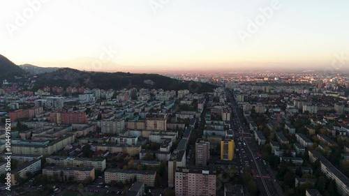 Wallpaper Mural 4K aerial shot of the city with mountains in Brasov, Romania. Towering mountains in background harmony between city and nature. Torontodigital.ca