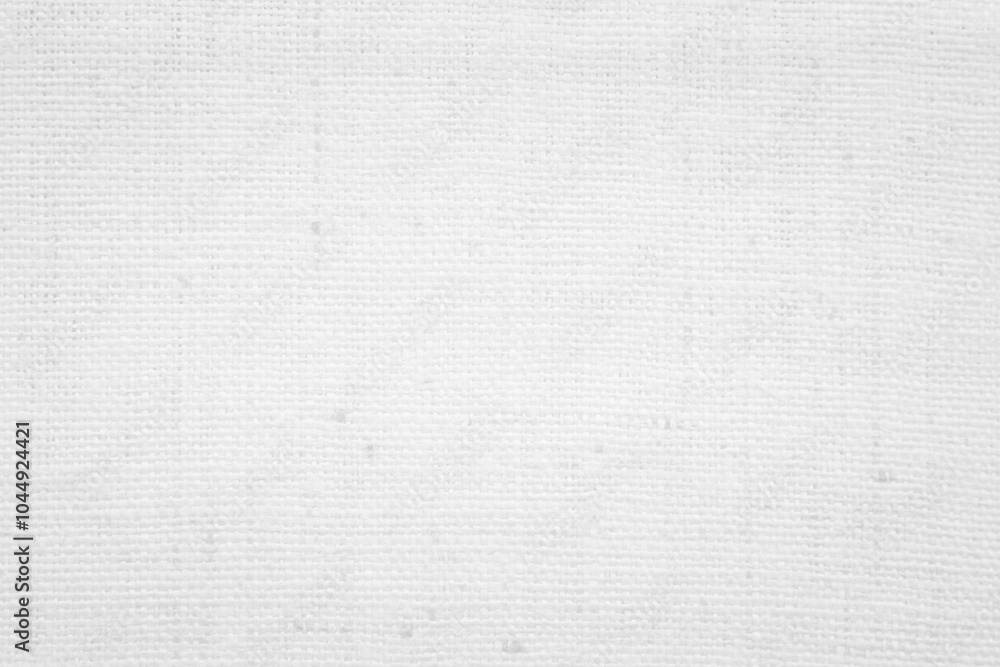 Fototapeta premium White textures of canvas, fabric, and paper showcasing a seamless design in natural shades of gray, ideal for a vintage backdrop or textile pattern.