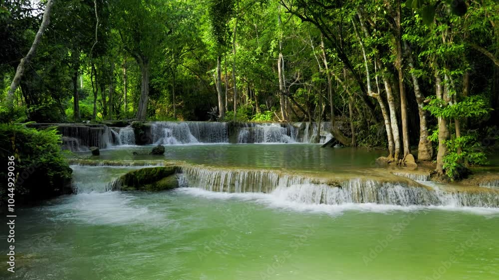 Huai Mae Khamin Waterfall is located in Kanchanaburi Province, Thailand. It is a beautiful waterfall with cool and refreshing water temperatures. It is located in a lush forest with large green trees. Huai Mae Khamin Waterfall is located in Kanchanaburi Province, Thailand. It is a beautiful waterfall with cool and refreshing water temperatures. It is located in a lush forest with large green trees.