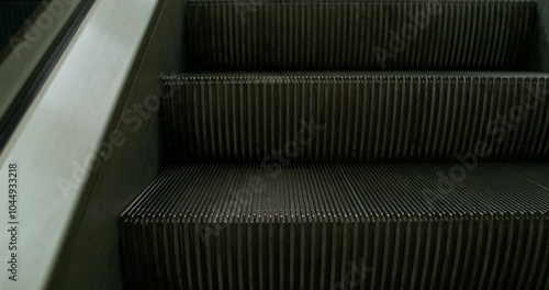 An escalator without people. Close-up of moving steps.