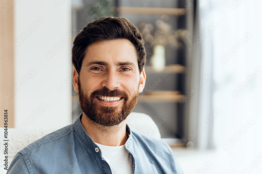 Portrait of handsome, smiling Latin man looking at camera posing at home dental care Portrait of handsome, smiling Latin man looking at camera posing at home dental care