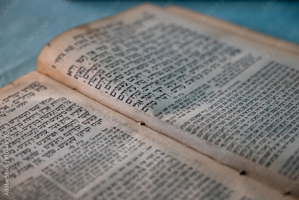 closeup of an old book written in hebrew - jewish religious background closeup of an old book written in hebrew - jewish religious background