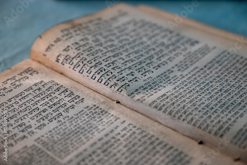 closeup of an old book written in hebrew - jewish religious background