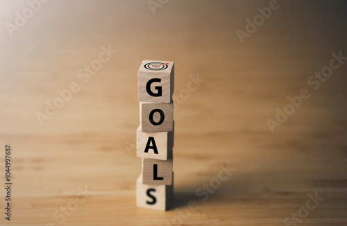 Wooden block with text GOALS. key performance indicator and businees achievement goal concept. photo