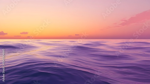 A calm sea at sunset, with the horizon blending into a gradient of purples and oranges, creates an atmosphere that feels serene and peaceful.