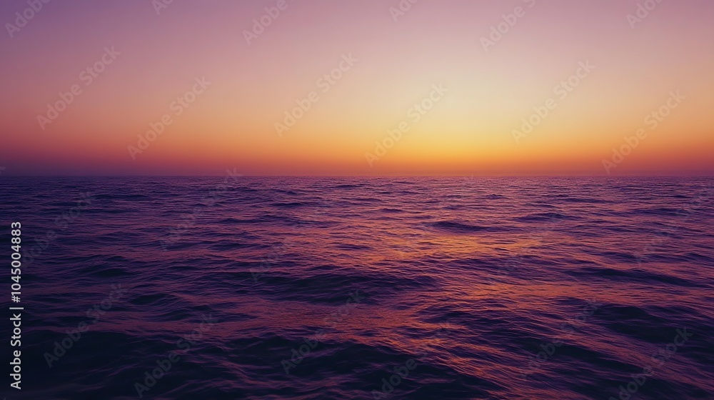 A calm sea at sunset, with the horizon blending into a gradient of purples and oranges, creates an atmosphere that feels serene and peaceful. A calm sea at sunset, with the horizon blending into a gradient of purples and oranges, creates an atmosphere that feels serene and peaceful.
