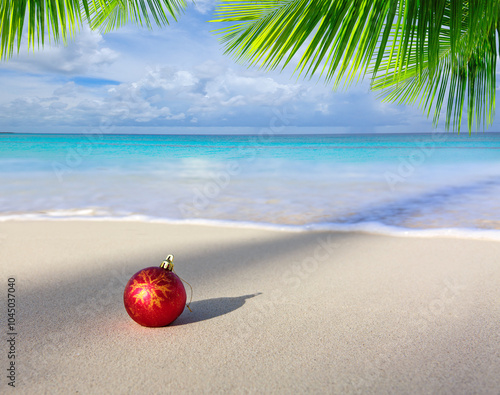 Merry Christmas background with red ball on Caribbean beach.