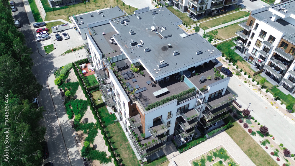 Contemporary apartment building with landscaped rooftop and patio Contemporary apartment building with landscaped rooftop and patio