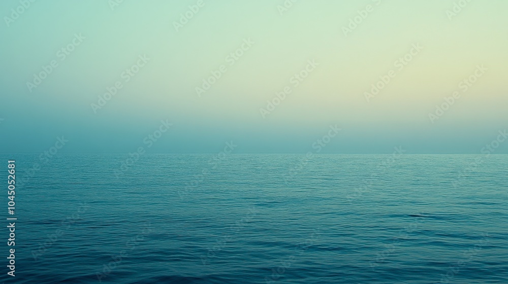 Fototapeta premium Calm Ocean Surface with Soft Blue Hues at Dusk
