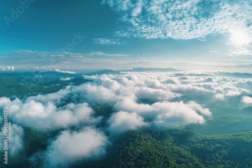 Serene Aerial View of Lush Green Mountains and Clouds