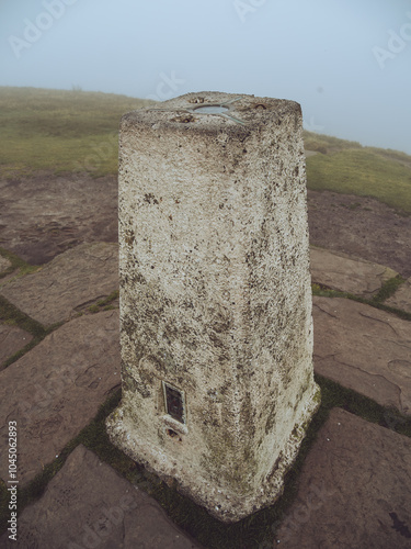 A trig point on the top of a peak in the Peak District, Cheshire
