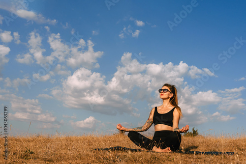 Obraz na płótnie Woman Practicing Yoga Outdoors Early in Morning w salonie